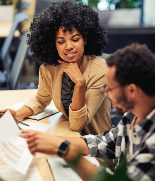 two-young-diverse-coworkers-analyzing-sales-report-while-working-together-in-the-office-1-qgp8b5fgenip2ryk78o93ut0un7occ4qt2pm0dhfq8 two-young-diverse-coworkers-analyzing-sales-report-while-working-together-in-the-office-1-qgp8b5fgenip2ryk78o93ut0un7occ4qt2pm0dhfq8